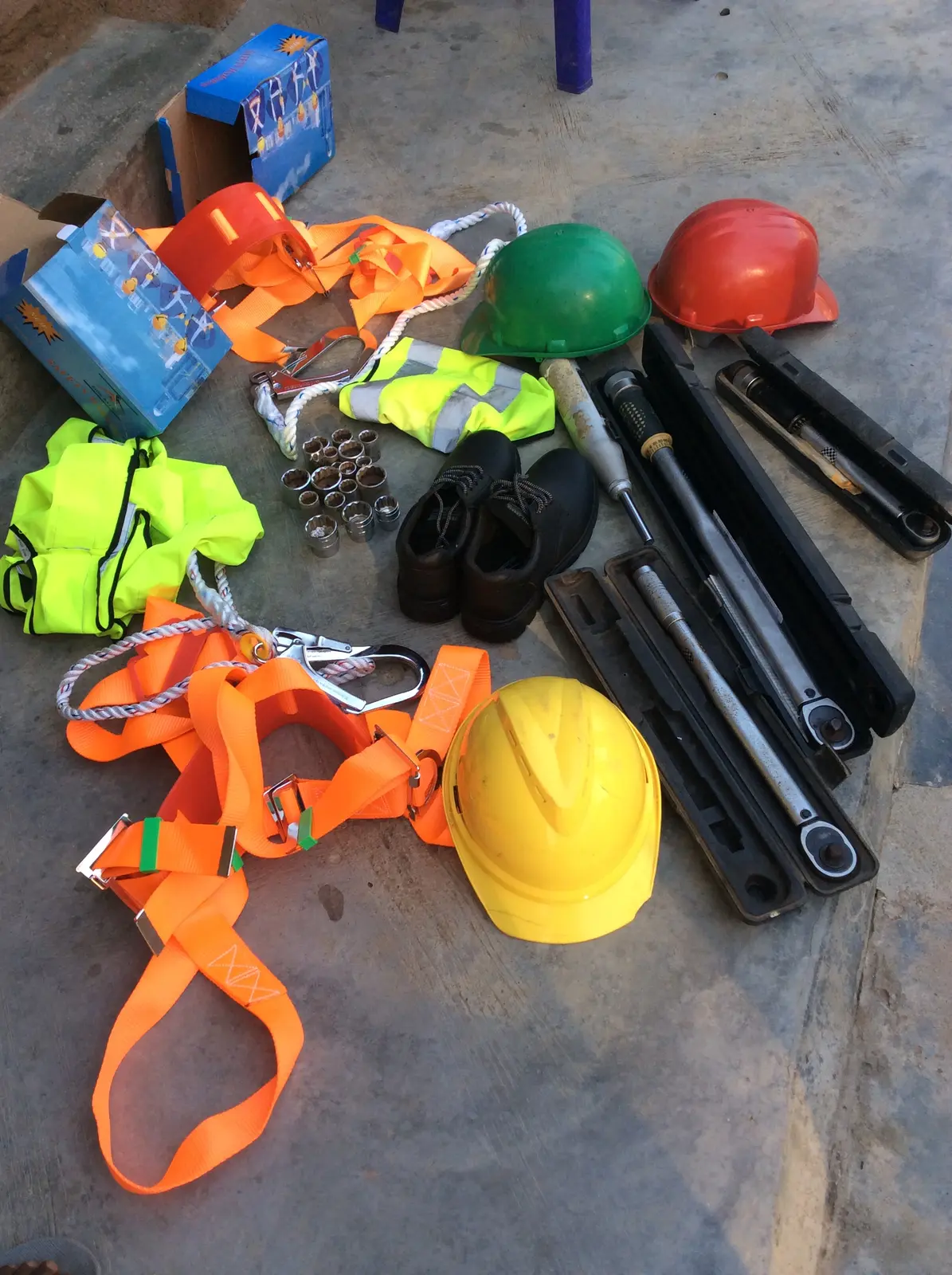 Safety harnesses, helmets, boots and field installation tools