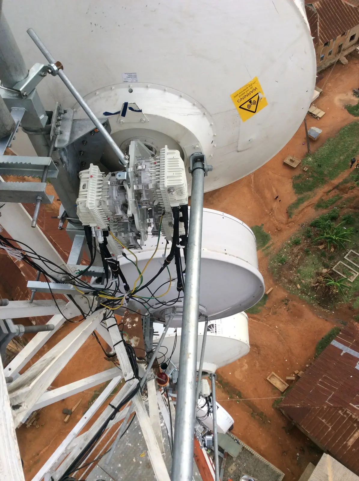 Outdoor radio units integrated with satellite communications infrastructure