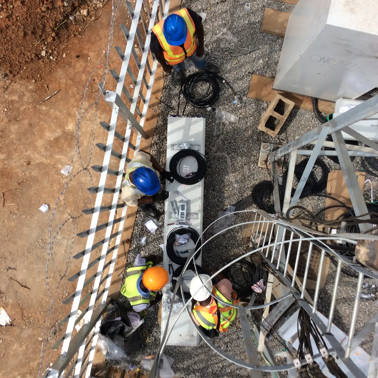 View of engineers and equipment during telecommunications tower work